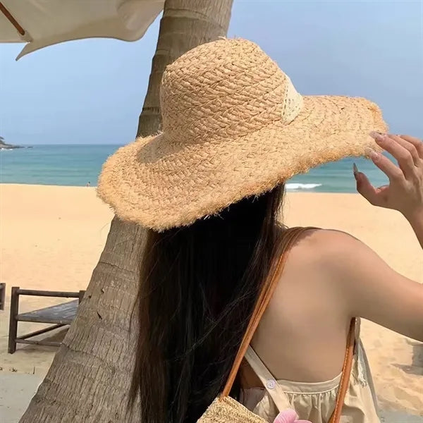 Wide brimmed raffia straw hat