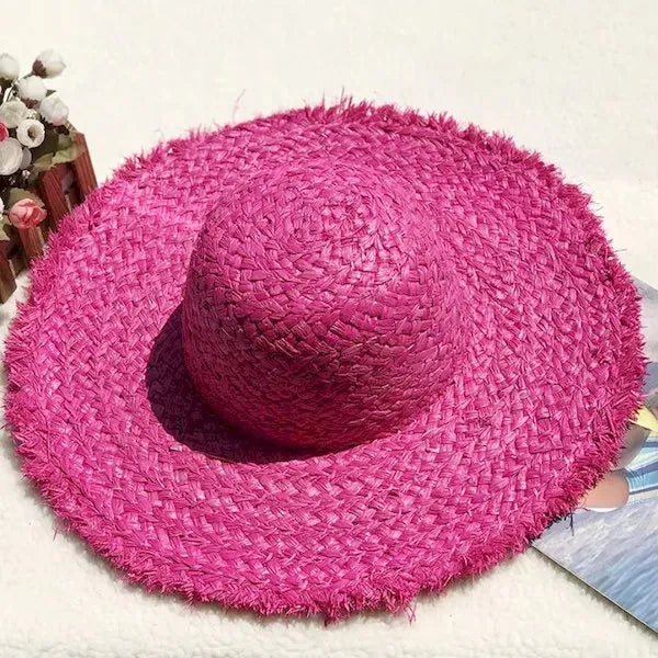 Wide brimmed raffia straw hat