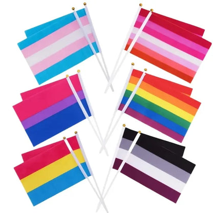 Hand Waving Rainbow Flags