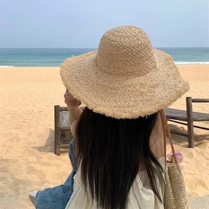 Wide brimmed raffia straw hat