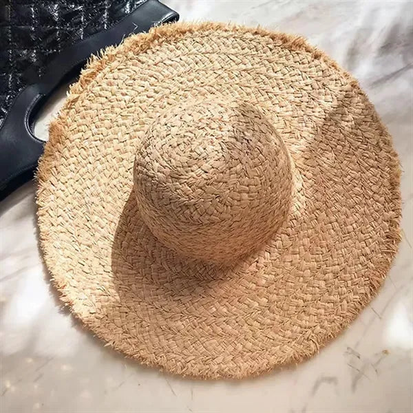 Wide brimmed raffia straw hat
