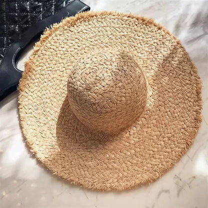 Wide brimmed raffia straw hat