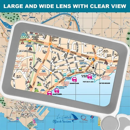 Seniors reading handheld 4X magnifying glass with light