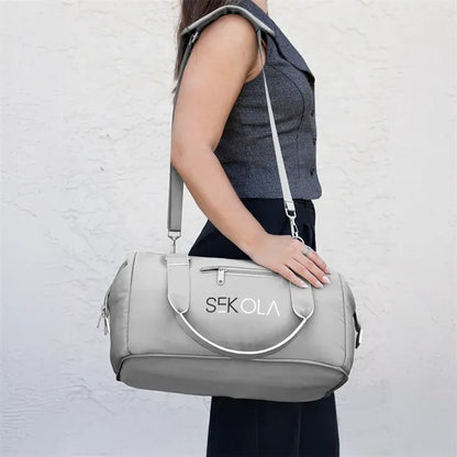 The Weekender Mini Travel Bag With Drop Bottom