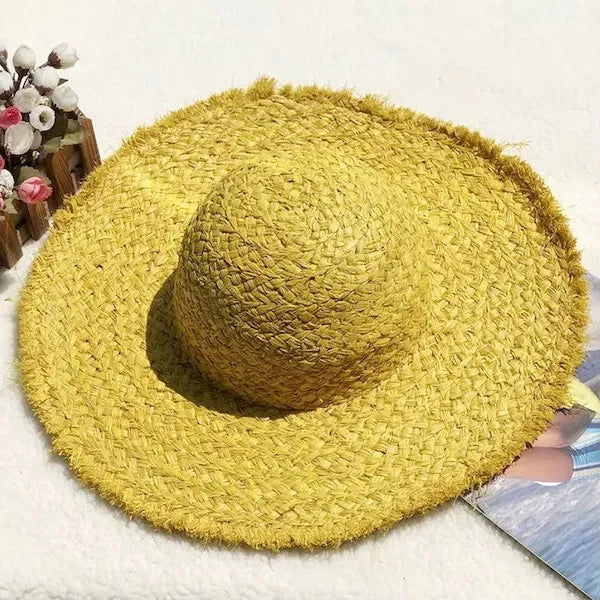 Wide brimmed raffia straw hat