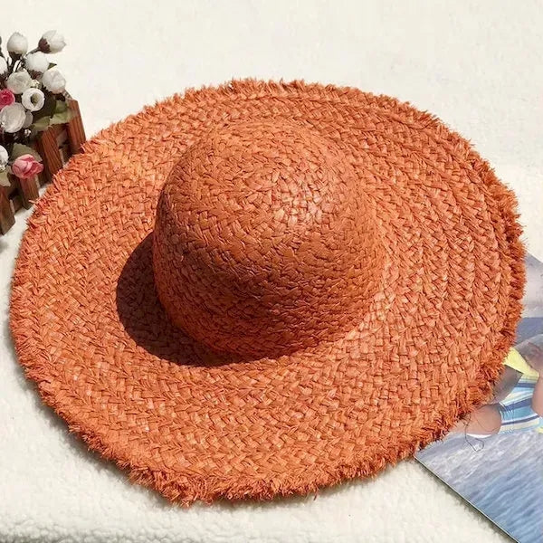 Wide brimmed raffia straw hat