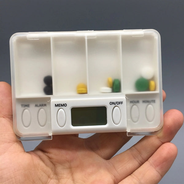 Pill box with alarm clock